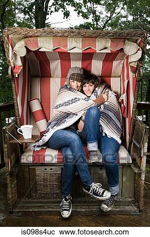 Female friends in beach chair View Large Photo Image Stock Image - Female friends in beach chair. Fotosearch