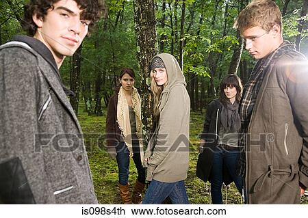 Stock Image - Friends in a forest. Fotosearch