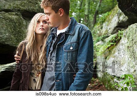 Picture - Young couple by rocks. Fotosearch