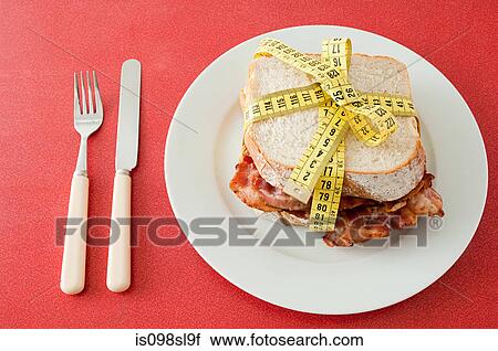 Bacon sandwich and tape measure View Large Photo Image Stock Image - Bacon sandwich and tape measure. Fotosearch