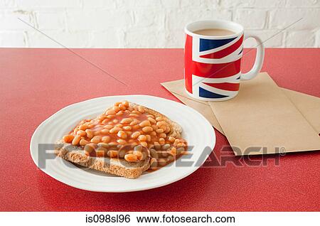 Stock Photograph - Beans on toast and tea. Fotosearch