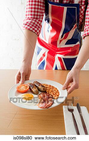 Person serving english breakfast View Large Photo Image Stock Image - Person serving english breakfast. Fotosearch