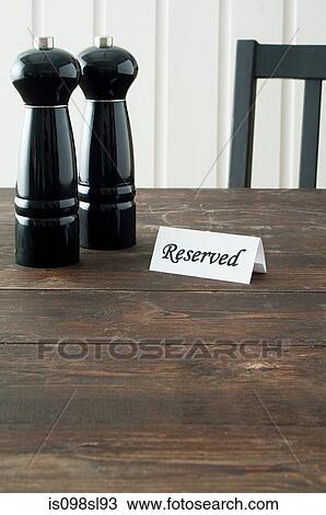 Salt and pepper mills and reserved sign View Large Photo Image Stock Image - Salt and pepper mills and reserved sign. Fotosearch