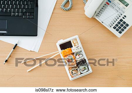 Sushi at desk View Large Photo Image Stock Photo - Sushi at desk. Fotosearch