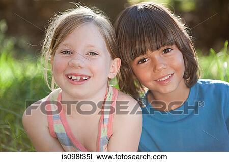 Boy and girl smiling View Large Photo Image Stock Image - Boy and girl smiling. Fotosearch