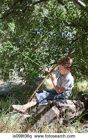 Stock Photography - Boy with bow and arrow. Fotosearch