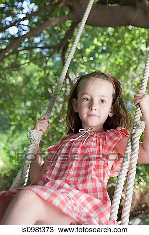 Girl on a swing View Large Photo Image Stock Image - Girl on a swing. Fotosearch