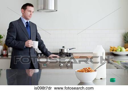 Stock Photography - Businessman having breakfast. Fotosearch