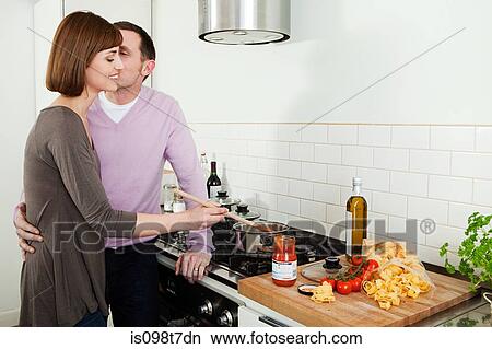 Couple cooking View Large Photo Image Picture - Couple cooking. Fotosearch