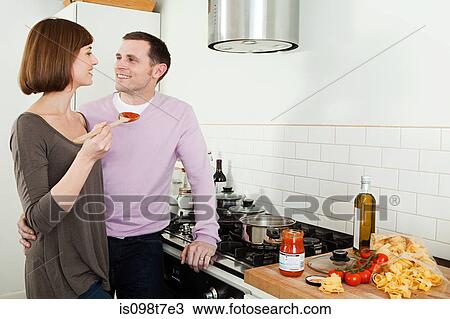 Stock Image - Couple cooking. Fotosearch
