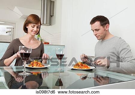 Couple having meal and wine View Large Photo Image Stock Photograph - Couple having meal and wine. Fotosearch