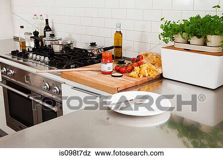Stock Photo - Food and utensils in kitchen. Fotosearch