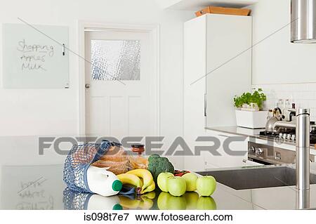 Groceries on kitchen counter View Large Photo Image Stock Photo - Groceries on kitchen counter. Fotosearch