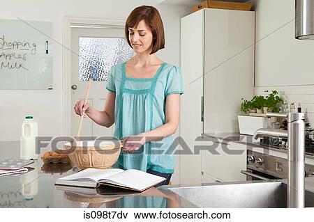Woman baking View Large Photo Image Stock Photo - Woman baking. Fotosearch