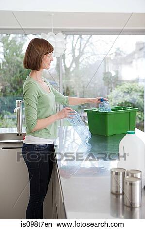 Woman doing recycling View Large Photo Image Picture - Woman doing recycling. Fotosearch