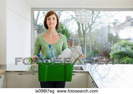 Stock Image - Woman doing recycling. Fotosearch