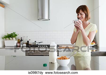 Woman having breakfast View Large Photo Image Stock Photo - Woman having breakfast. Fotosearch
