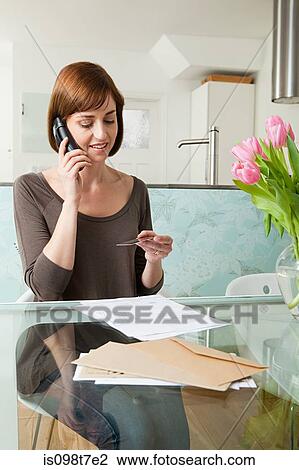 Woman on telephone with credit card View Large Photo Image Stock Image - Woman on telephone with credit card. Fotosearch