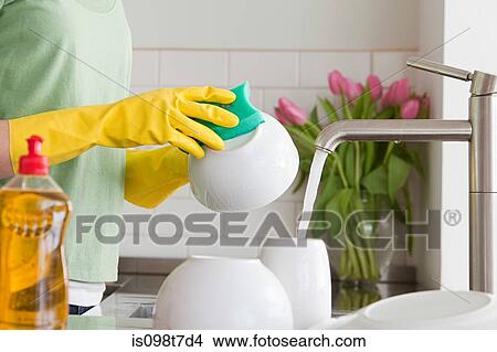 Woman washing up View Large Photo Image Picture - Woman washing up. Fotosearch