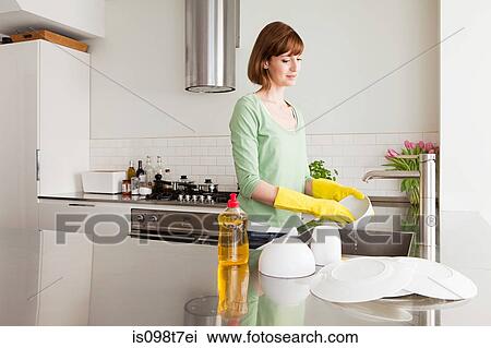 Woman washing up View Large Photo Image Stock Image - Woman washing up. Fotosearch