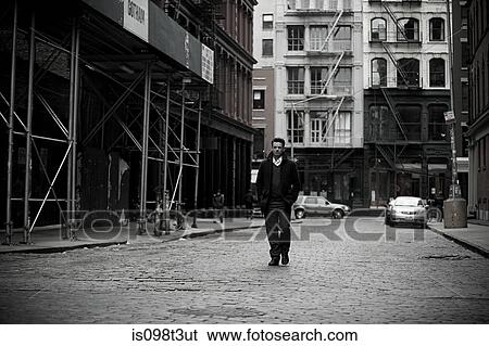 Stock Photograph - Man walking in new york city. Fotosearch