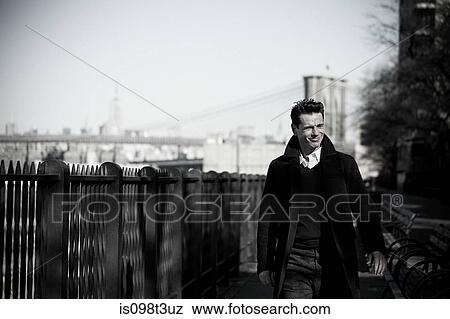 Man walking on brooklyn heights promenade View Large Photo Image Stock Photo - Man walking on brooklyn heights promenade. Fotosearch