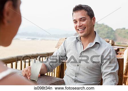 Couple at beach bar View Large Photo Image Picture - Couple at beach bar. Fotosearch
