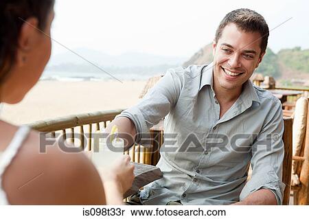 Couple at beach bar View Large Photo Image Stock Photography - Couple at beach bar. Fotosearch