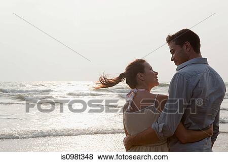 Stock Photo - Couple by the ocean. Fotosearch