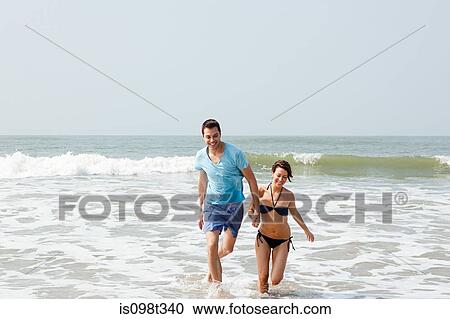 Couple having fun in the sea View Large Photo Image Stock Image - Couple having fun in the sea. Fotosearch
