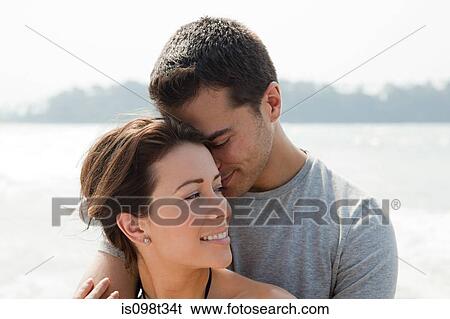 Loving couple by the sea View Large Photo Image Stock Photograph - Loving couple by the sea. Fotosearch