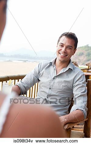 Man at beach bar View Large Photo Image Stock Photo - Man at beach bar. Fotosearch