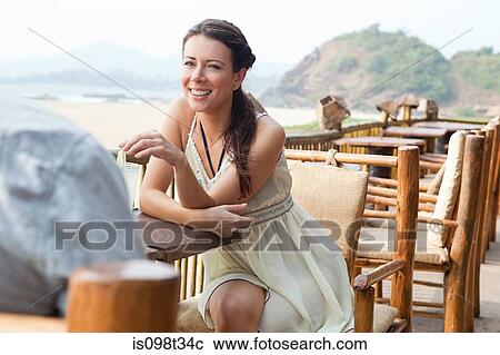 Woman at beach bar View Large Photo Image Stock Image - Woman at beach bar. Fotosearch