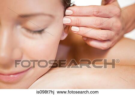 Woman having face massage View Large Photo Image Stock Image - Woman having face massage. Fotosearch