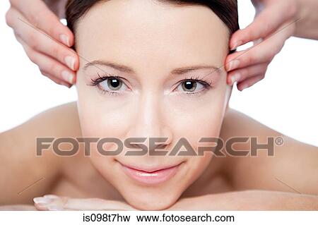 Stock Photo - Woman having face massage. Fotosearch