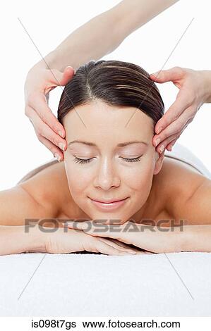 Stock Photograph - Woman having face massage. Fotosearch