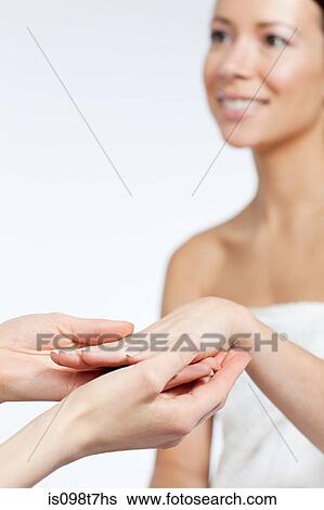 Woman having hand massage View Large Photo Image Stock Photograph - Woman having hand massage. Fotosearch