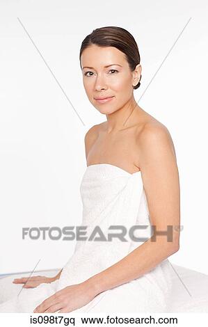 Young woman wearing towel View Large Photo Image Stock Photography - Young woman wearing towel. Fotosearch