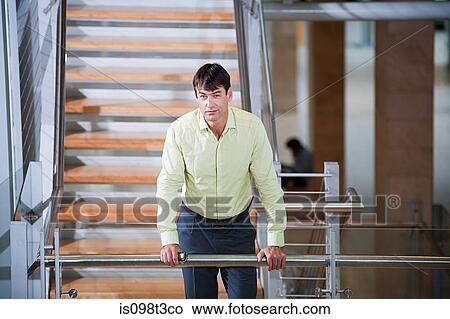 Businessman on stairwell View Large Photo Image Picture - Businessman on stairwell. Fotosearch