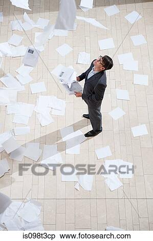 Businessman throwing papers View Large Photo Image Stock Photography - Businessman throwing papers. Fotosearch