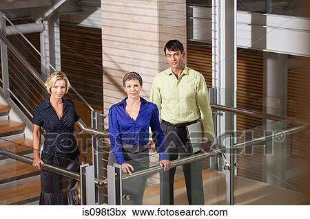 Businesspeople on stairwell View Large Photo Image Stock Photo - Businesspeople on stairwell. Fotosearch
