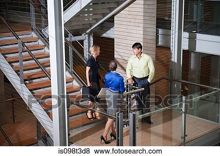 Businesspeople on stairwell View Large Photo Image Stock Photo - Businesspeople on stairwell. Fotosearch