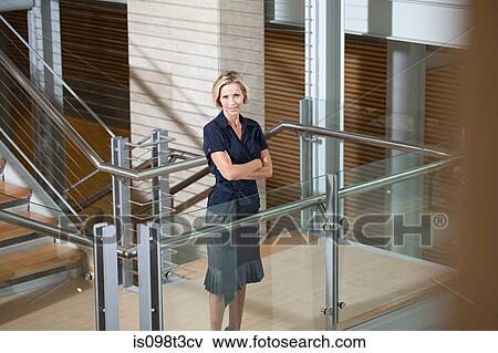 Businesswoman on stairwell View Large Photo Image Stock Photo - Businesswoman on stairwell. Fotosearch
