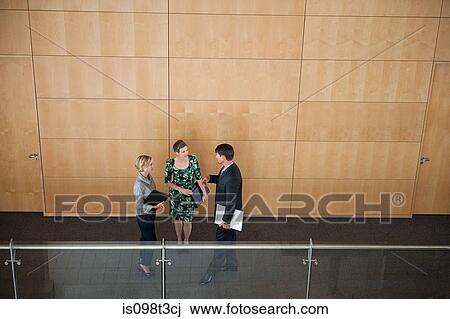 Colleagues in corridor View Large Photo Image Stock Image - Colleagues in corridor. Fotosearch