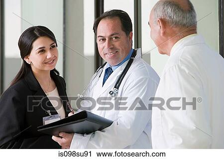 Doctors talking View Large Photo Image Stock Image - Doctors talking. Fotosearch
