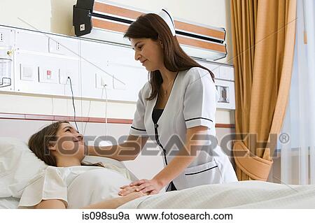 Nurse caring for patient View Large Photo Image Stock Image - Nurse caring for patient. Fotosearch