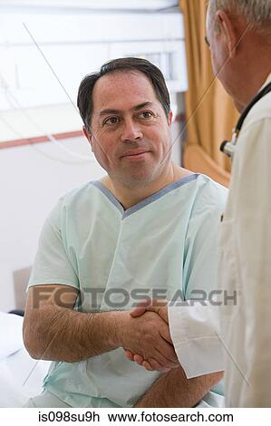 Patient and doctor shaking hands View Large Photo Image Stock Image - Patient and doctor shaking hands. Fotosearch