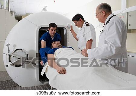 Patient being taken into hyperbaric chamber View Large Photo Image Stock Photo - Patient being taken into hyperbaric chamber. Fotosearch