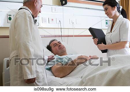 Patient in hospital with doctor and nurse View Large Photo Image Stock Image - Patient in hospital with doctor and nurse. Fotosearch