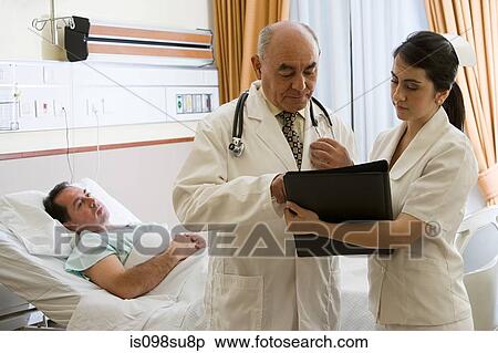 Patient in hospital with doctor and nurse View Large Photo Image Stock Photography - Patient in hospital with doctor and nurse. Fotosearch